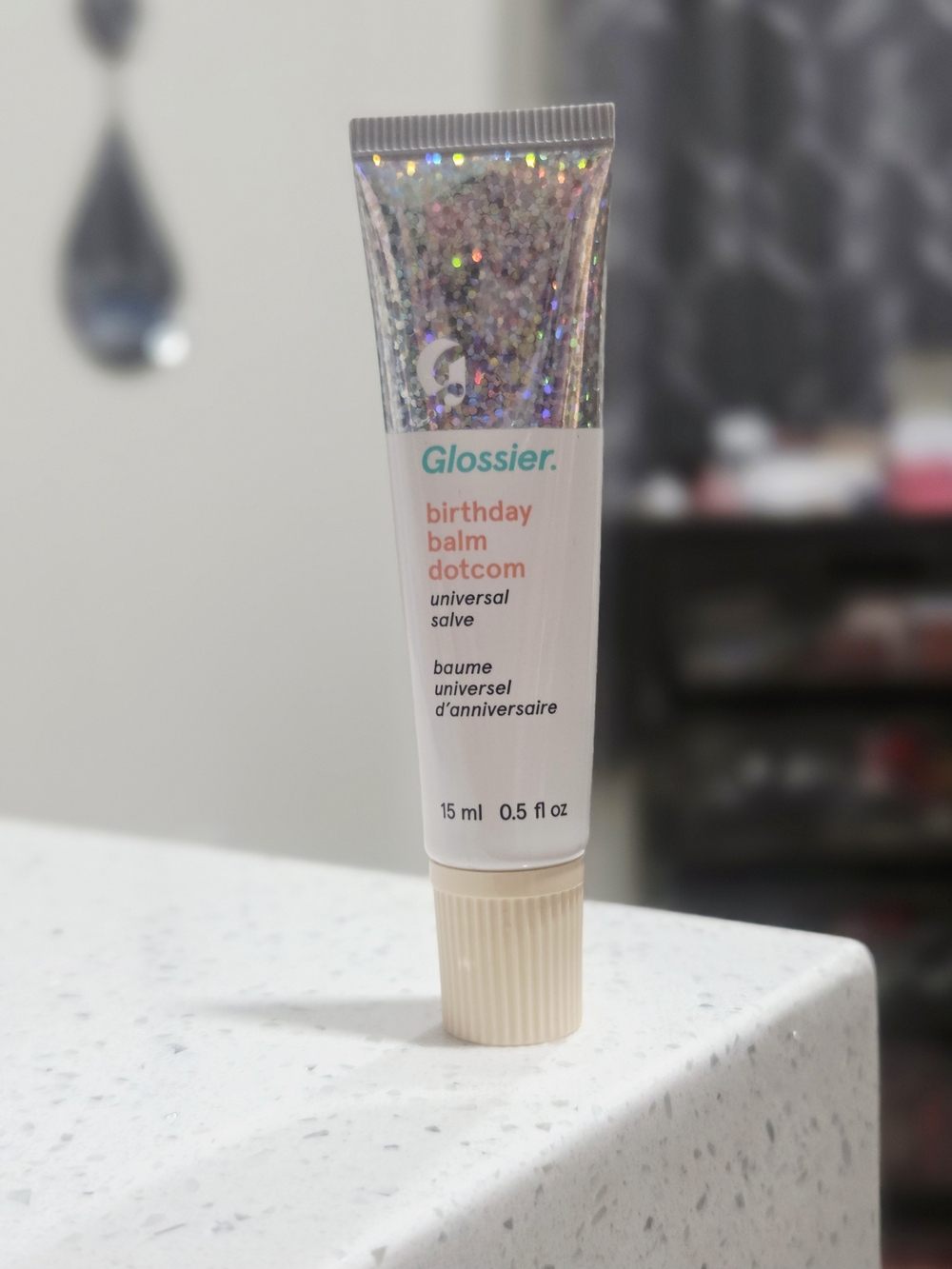 Glossier Birthday Balm Dotcom in Cream with Holographic Glitter Cap
